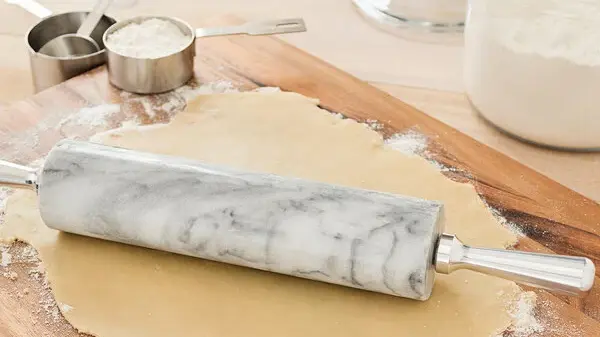 What Are Common Flaws and Repairs in Vintage Marble Rolling Pins?